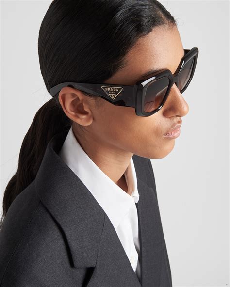 prada lentes|Prada sunglasses symbol.